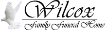Wilcox Family Funeral Home logo with white dove and cursive black lettering