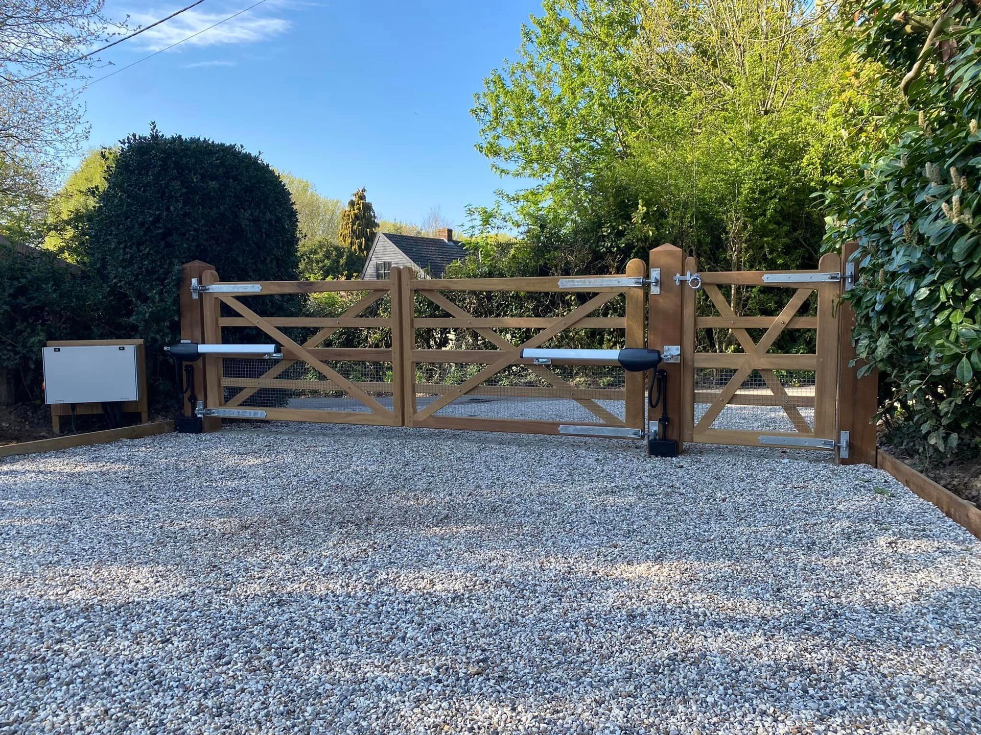 Bespoke Electric Gate that is farm style with a manual footpath gate next to it 
