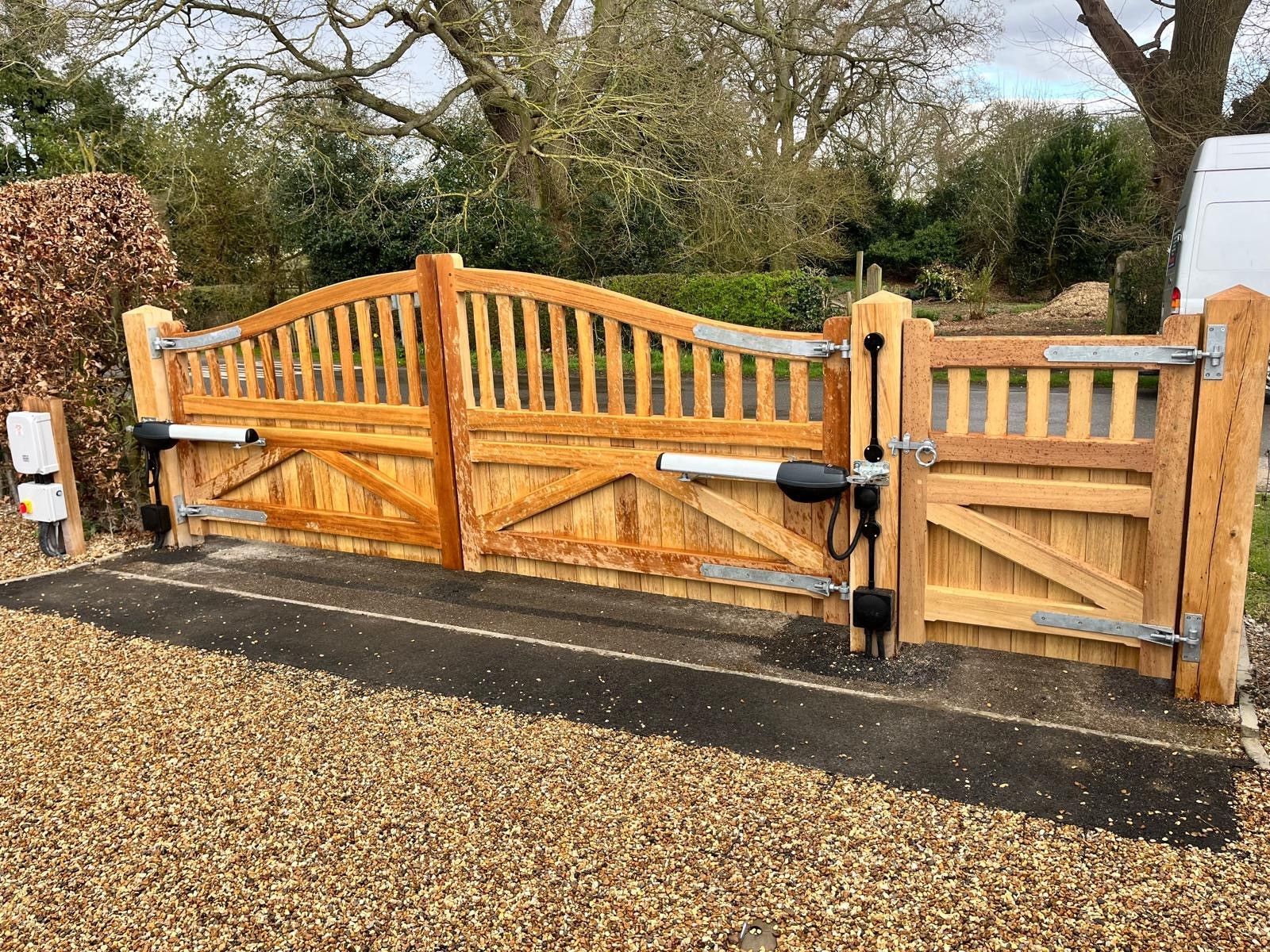 Bespoke timber-made electric gate with mannual footpath gate 
