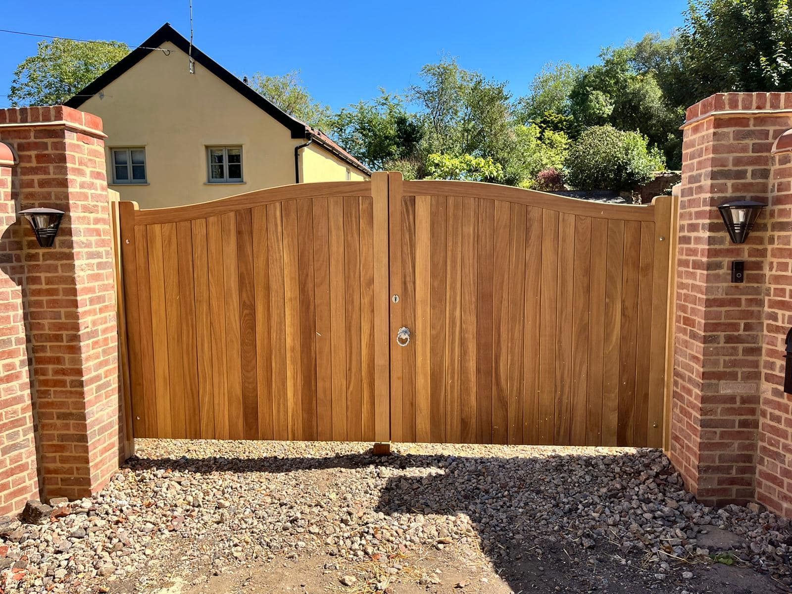 timber bespoke made Electric Gate with wall columns either side 