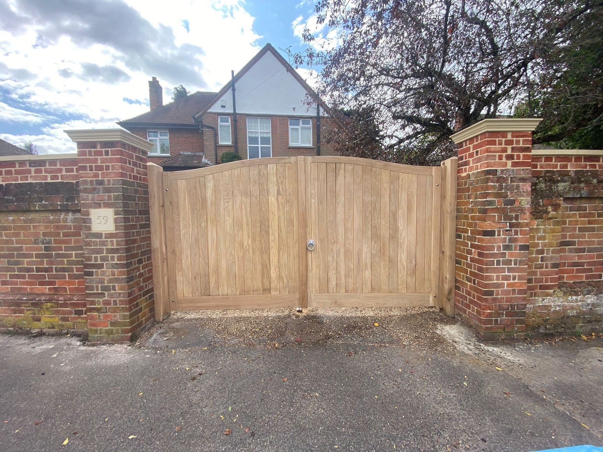 bespoke made Electric Gate with brick columns either side
