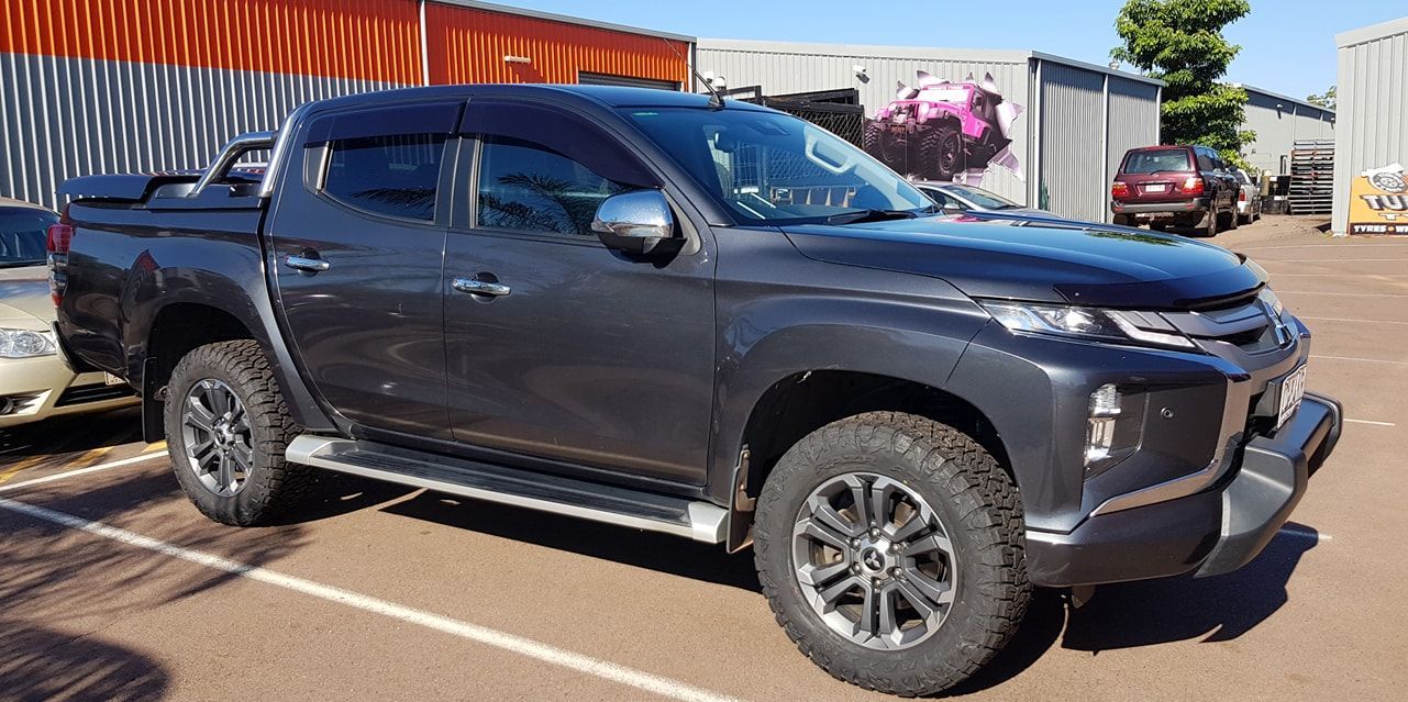 A Black Pickup Truck is Parked in a Parking Lot — Turbo's Tyres In Humpty Doo, NT
