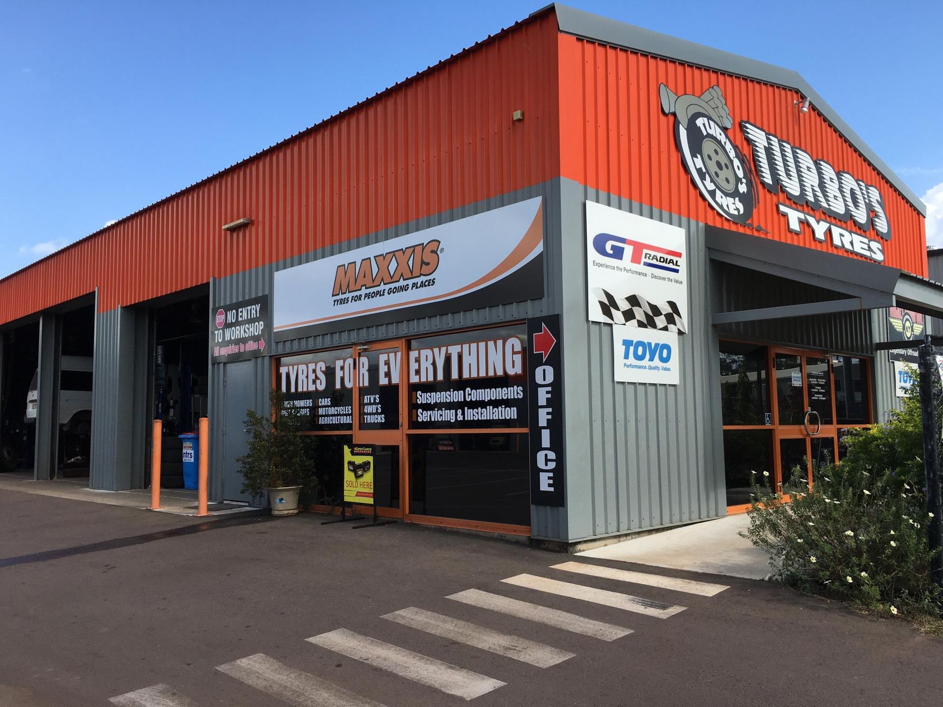 A Tyre is Sitting on Top of a Machine in a Garage — Turbo's Tyres In Humpty Doo, NT