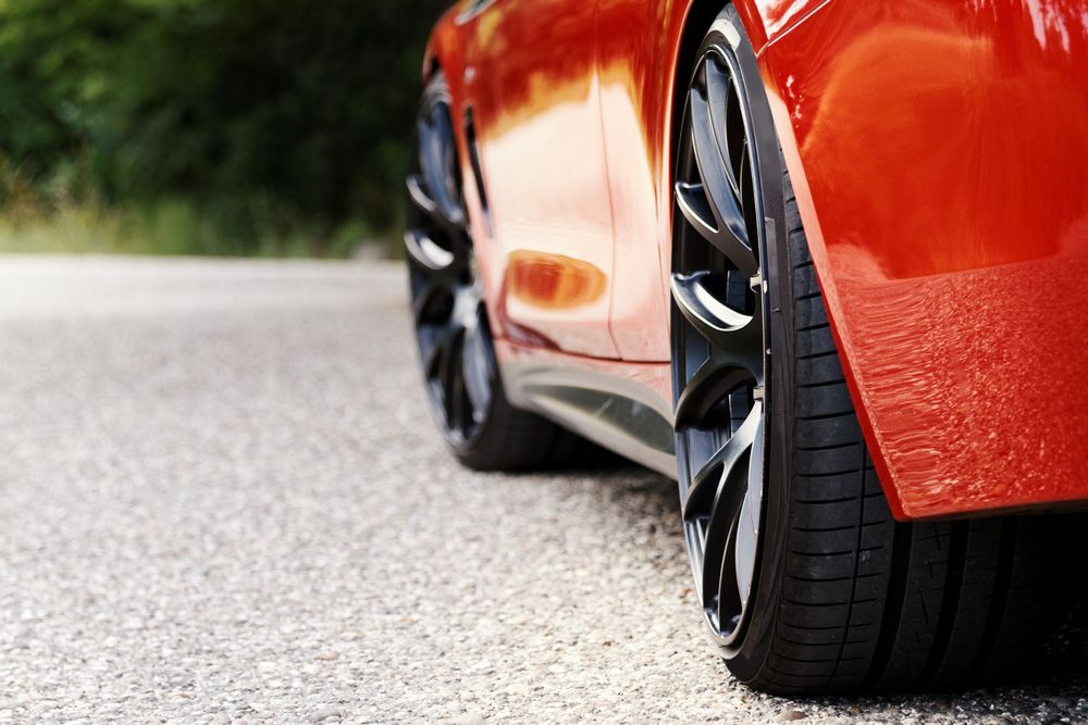 A Red Sports Car is Parked on the Side of the Road — Turbo's Tyres In Humpty Doo, NT