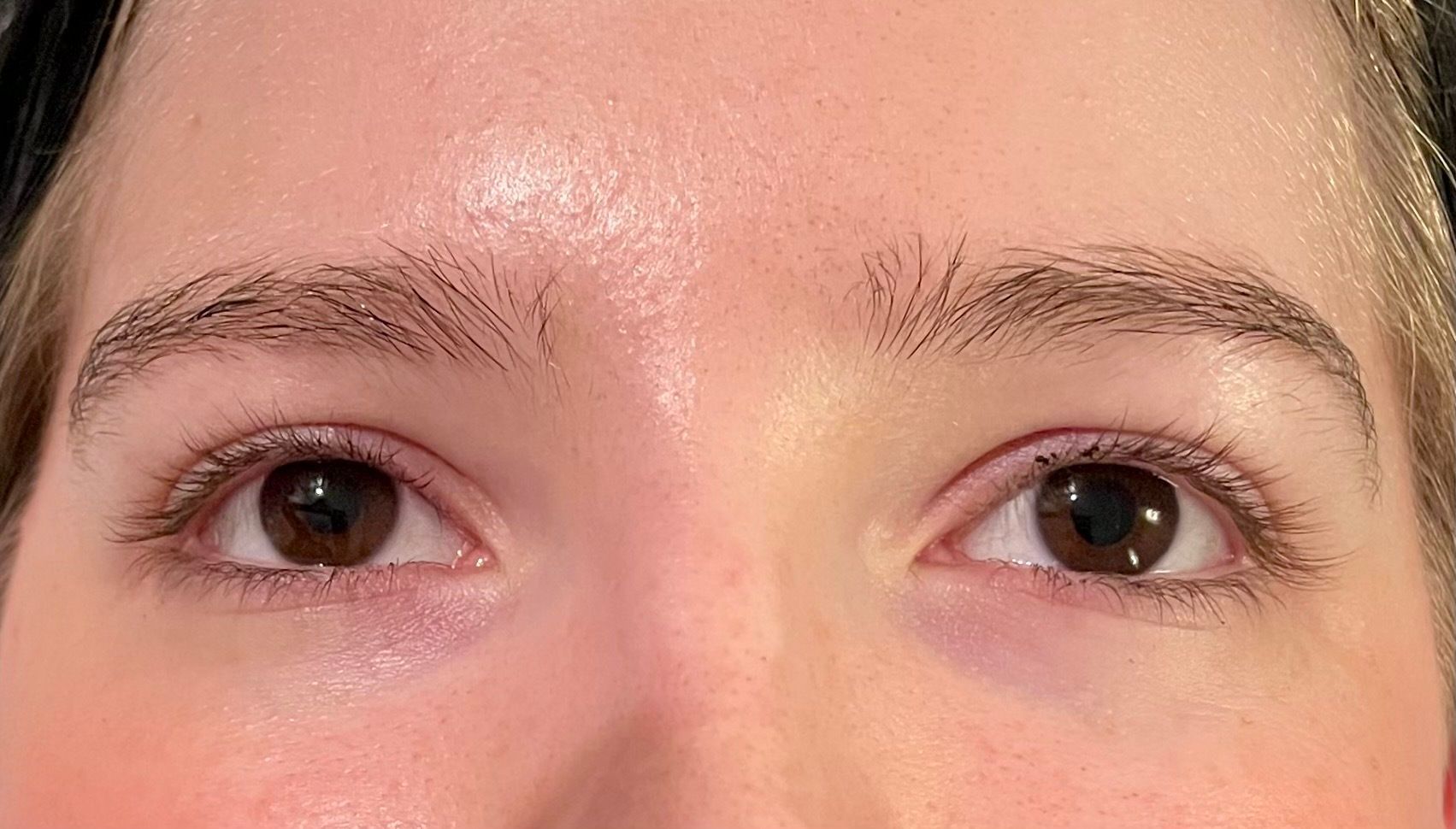 a close up of a person 's eyes before & after lash lift