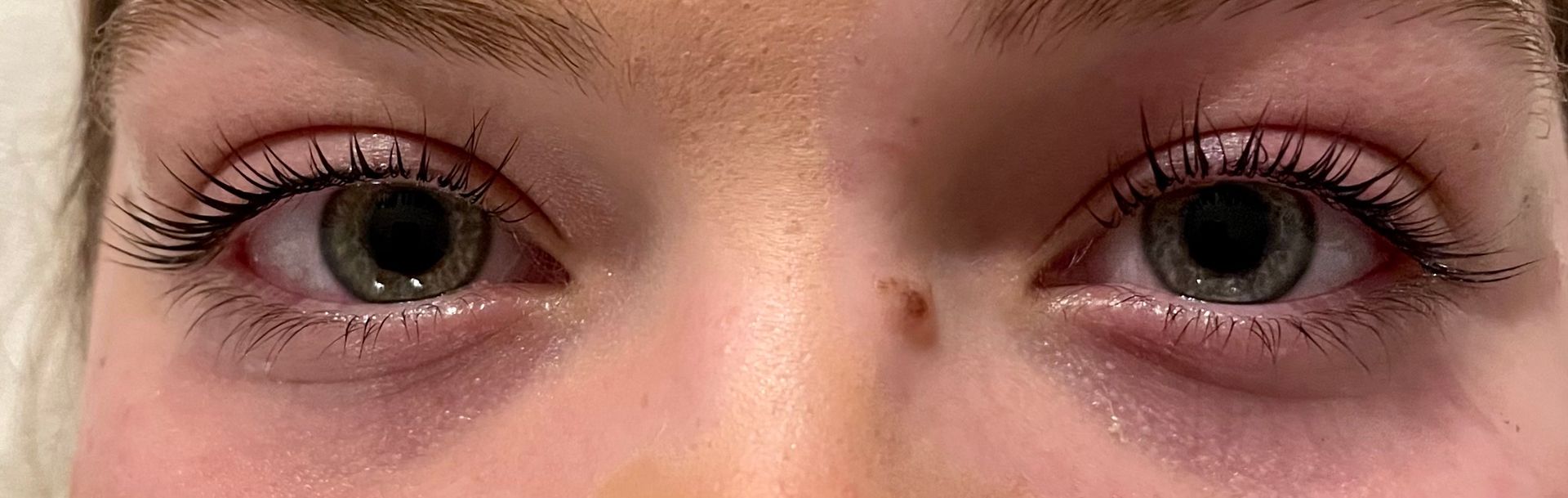 a close up of a person 's eyes before & after lash lift