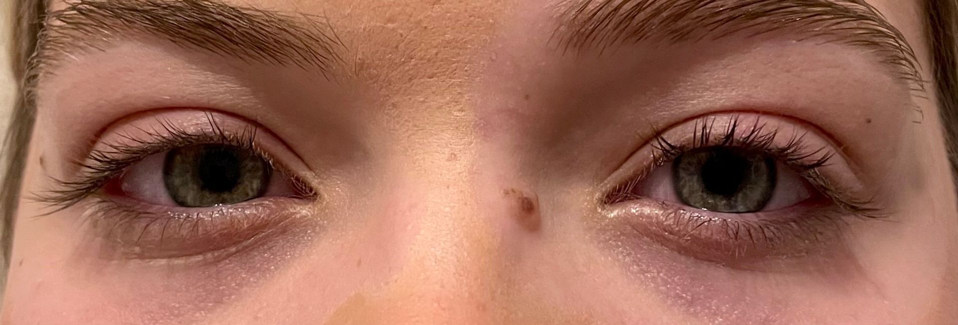 a close up of a person 's eyes before & after lash lift