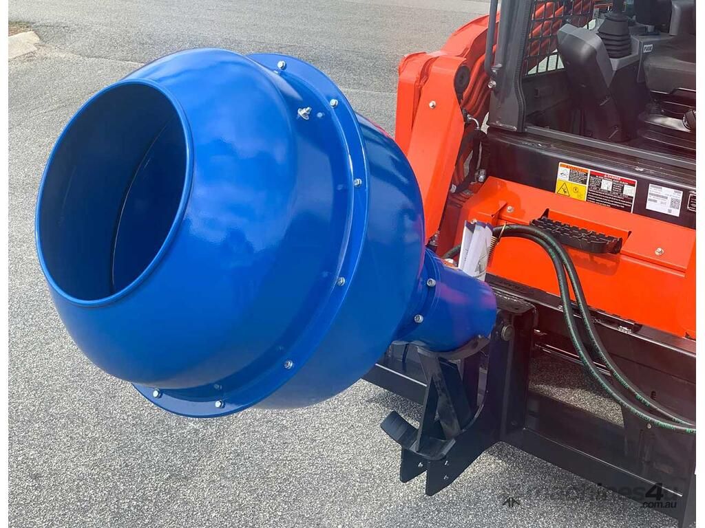 A blue concrete mixer is attached to a red tractor.