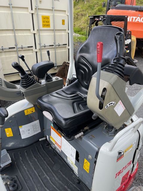 A tractor with the word hitachi on it