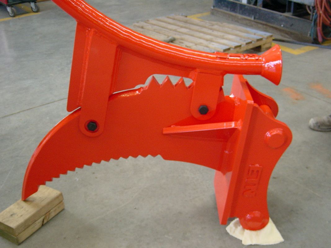 A close up of an orange object with a few teeth on it