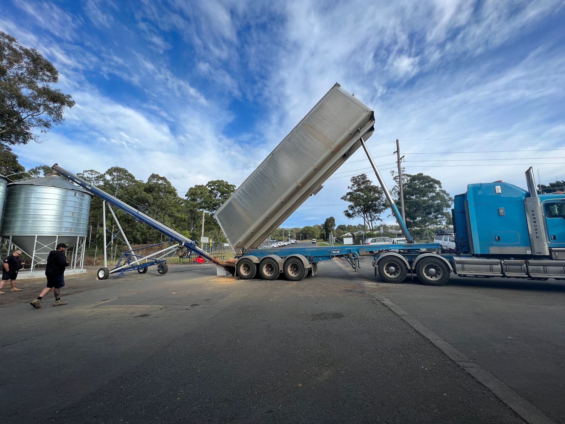 Blue Semi-truck Unloading Grain Into an Auger — Prostoc In South Kempsey, NSW
