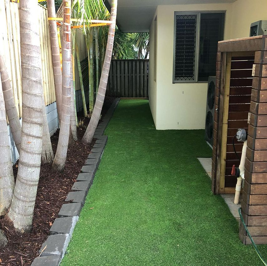 A Fenced in Yard with a Lush Green Lawn — HMJ Landscapes in Tweed Heads, NSW