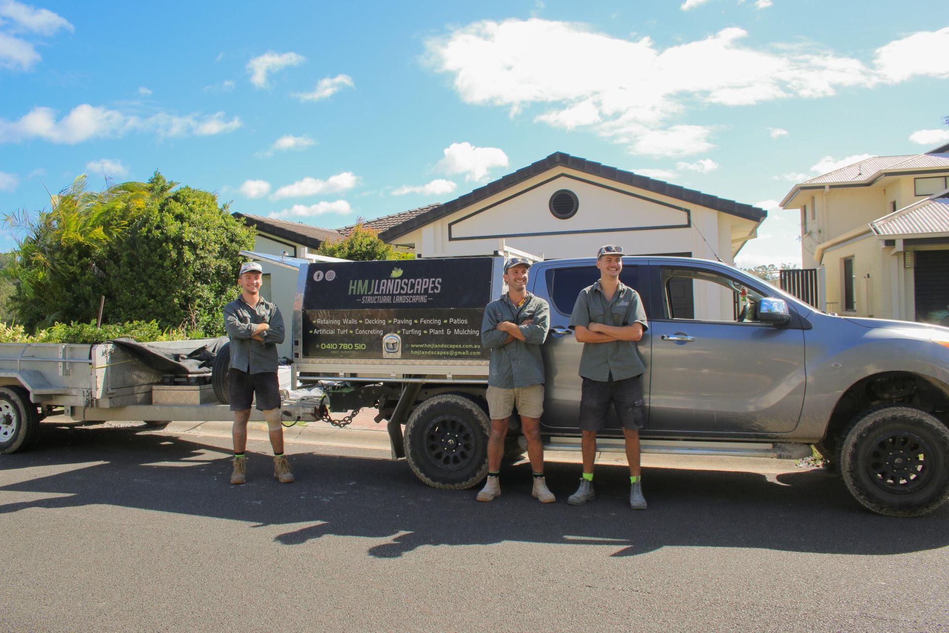 A Man Standing Next to a Truck That Says HM Landscapes — HMJ Landscapes in Broadbeach, QLD