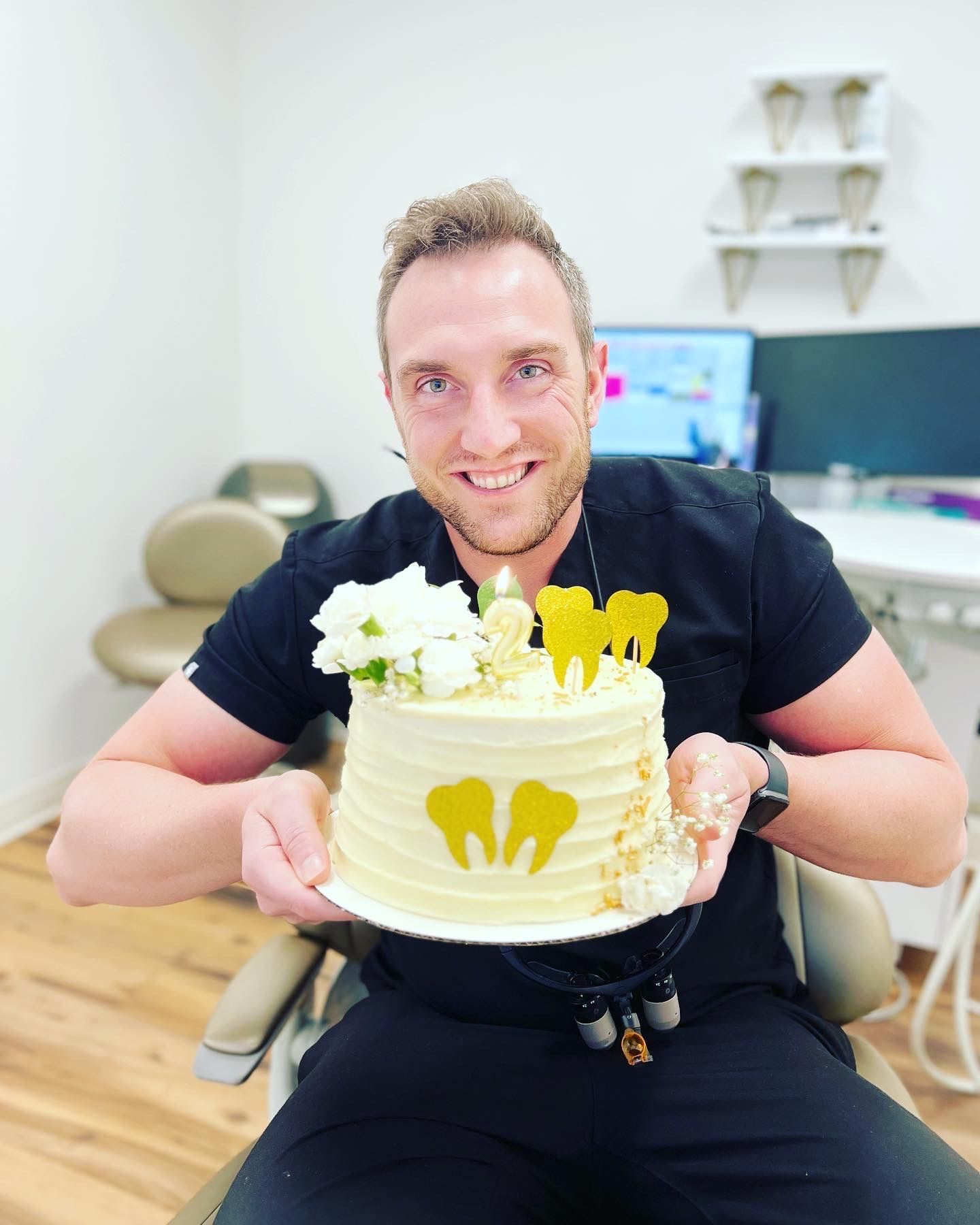 Dr. Vallo with 2 year anniversary cake