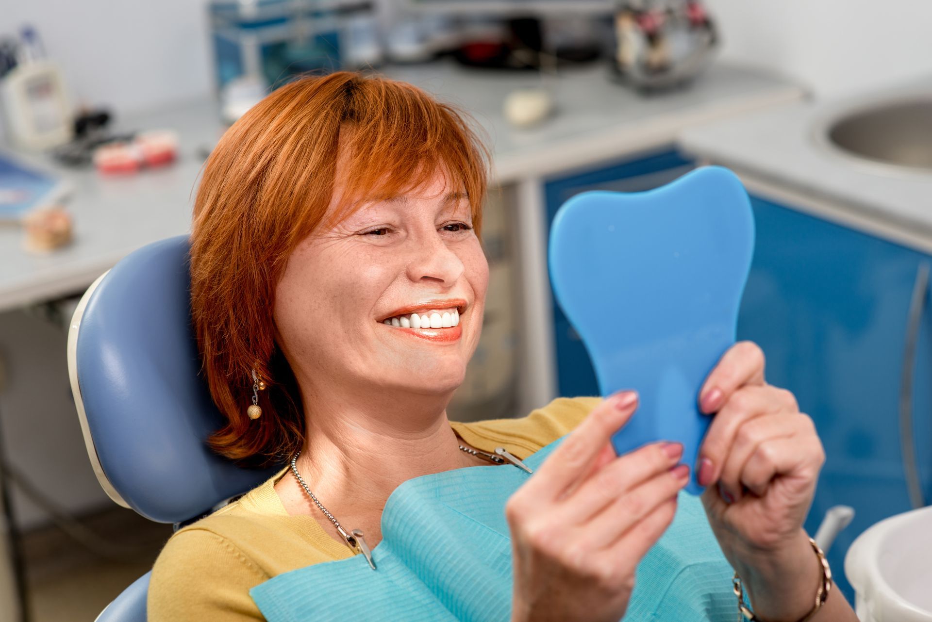 Woman looking happy with her Dental Crowns.