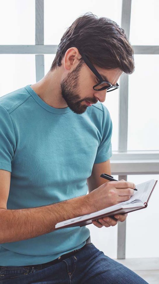 Man Taking Notes