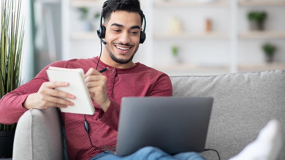 Man using laptop at home