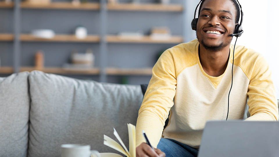 Man using laptop at home for learning