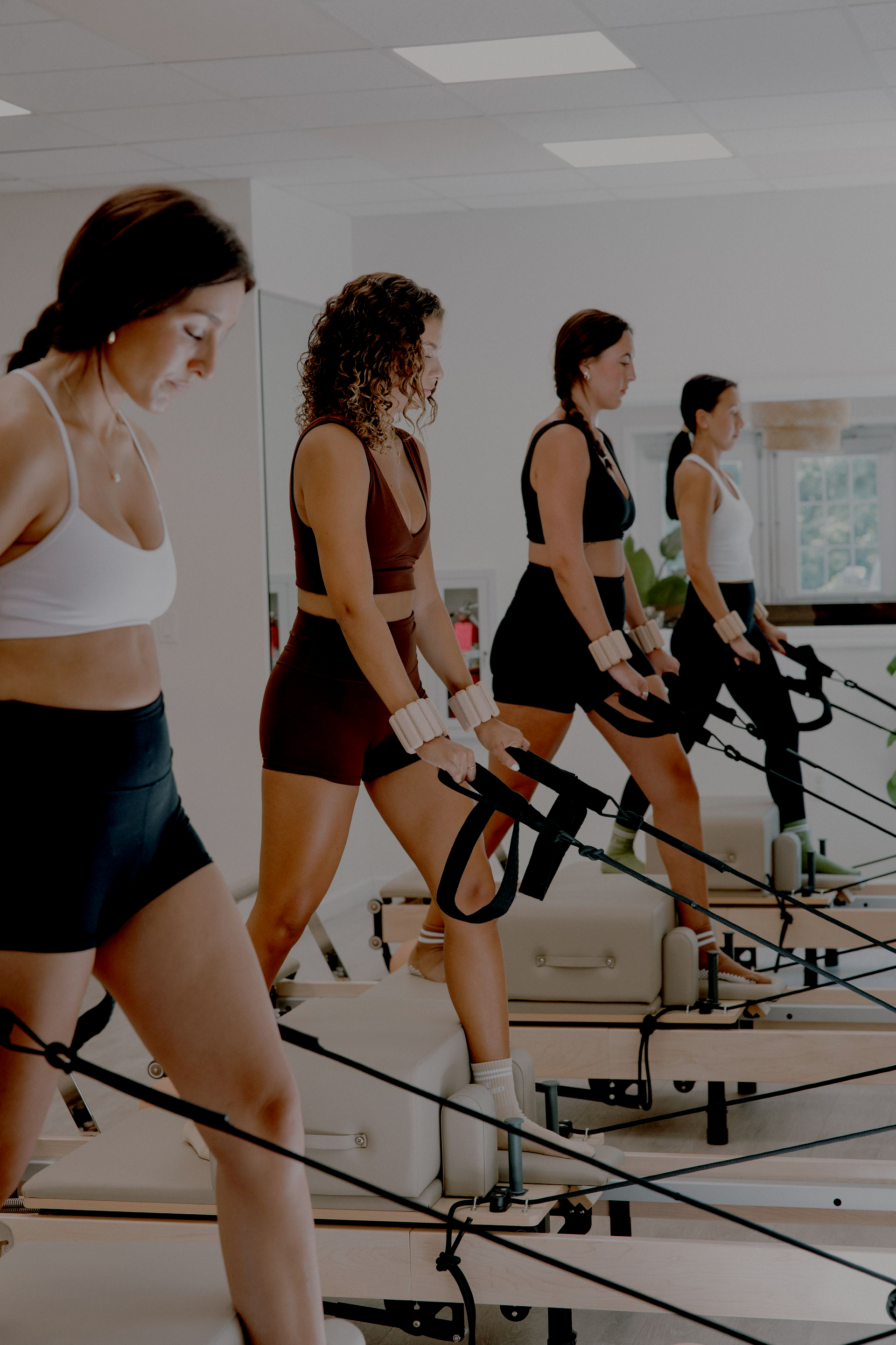 Students using Balanced Body reformer equipment at Eastern Shore Core