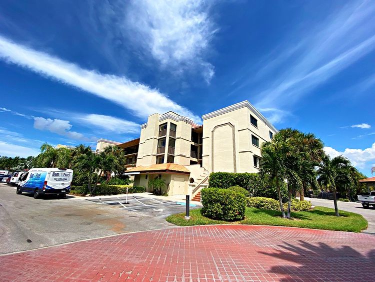 Madeira Beach condominium with new PGT impact windows and sliding glass doors installed by Hom-Excel