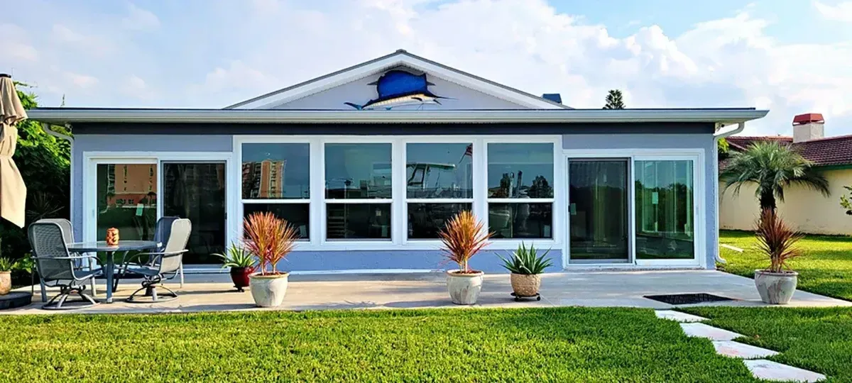 Waterfront home with new impact-rated windows and sliding glass doors installed by Hom-Excel