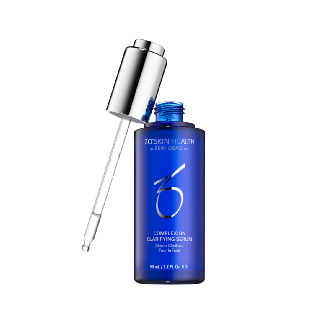 A blue glass bottle of ZO Skin Health serum with an open silver dropper top beside it on a white background.