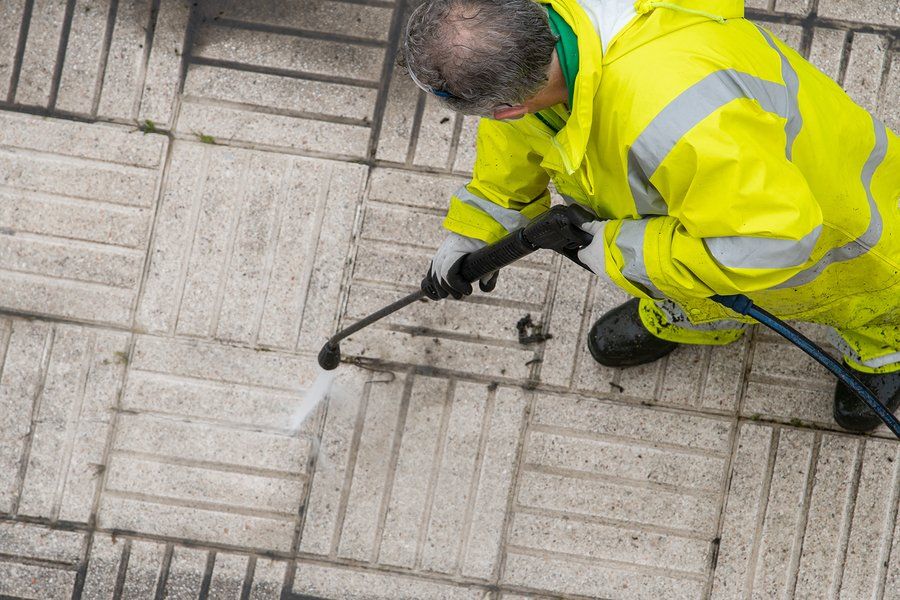 man using the pressure washer