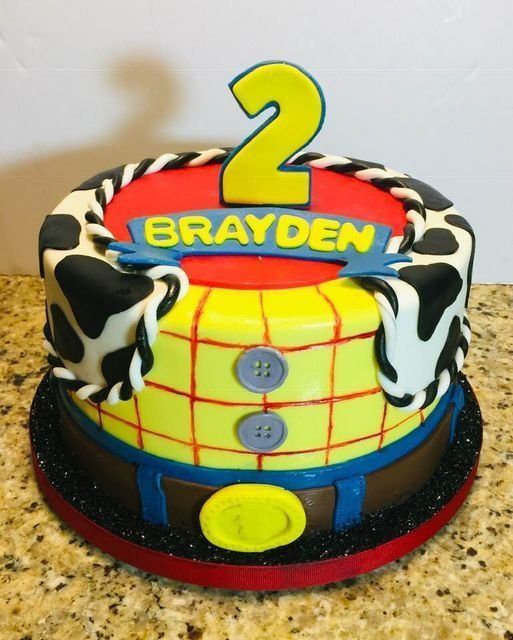 Colorful birthday cake with a yellow number 2 and the name Brayden on top