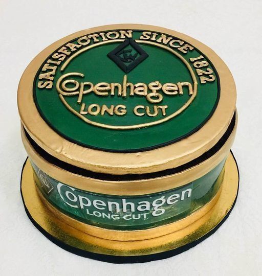 Copenhagen Long Cut tobacco tin with green and gold packaging and a round lid