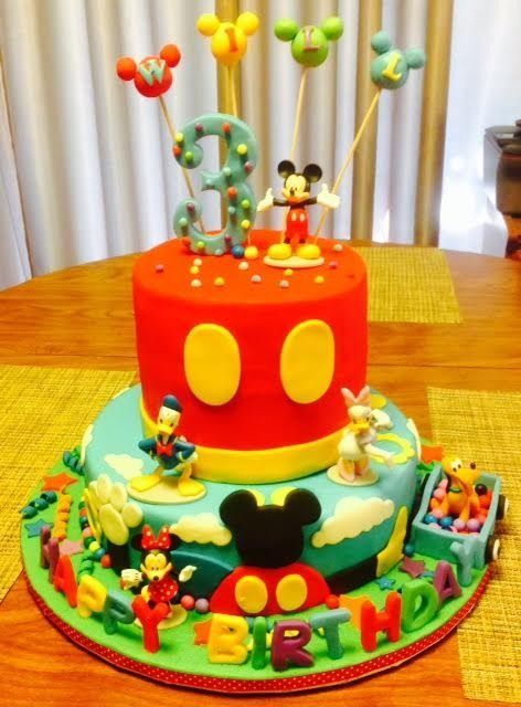 Mickey Mouse birthday cake with colorful decorations and the number 3 on top