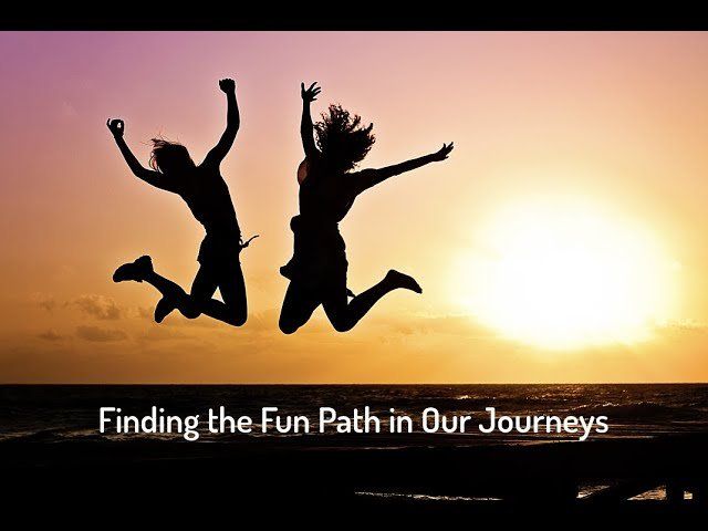 Silhouettes of two people jumping joyfully