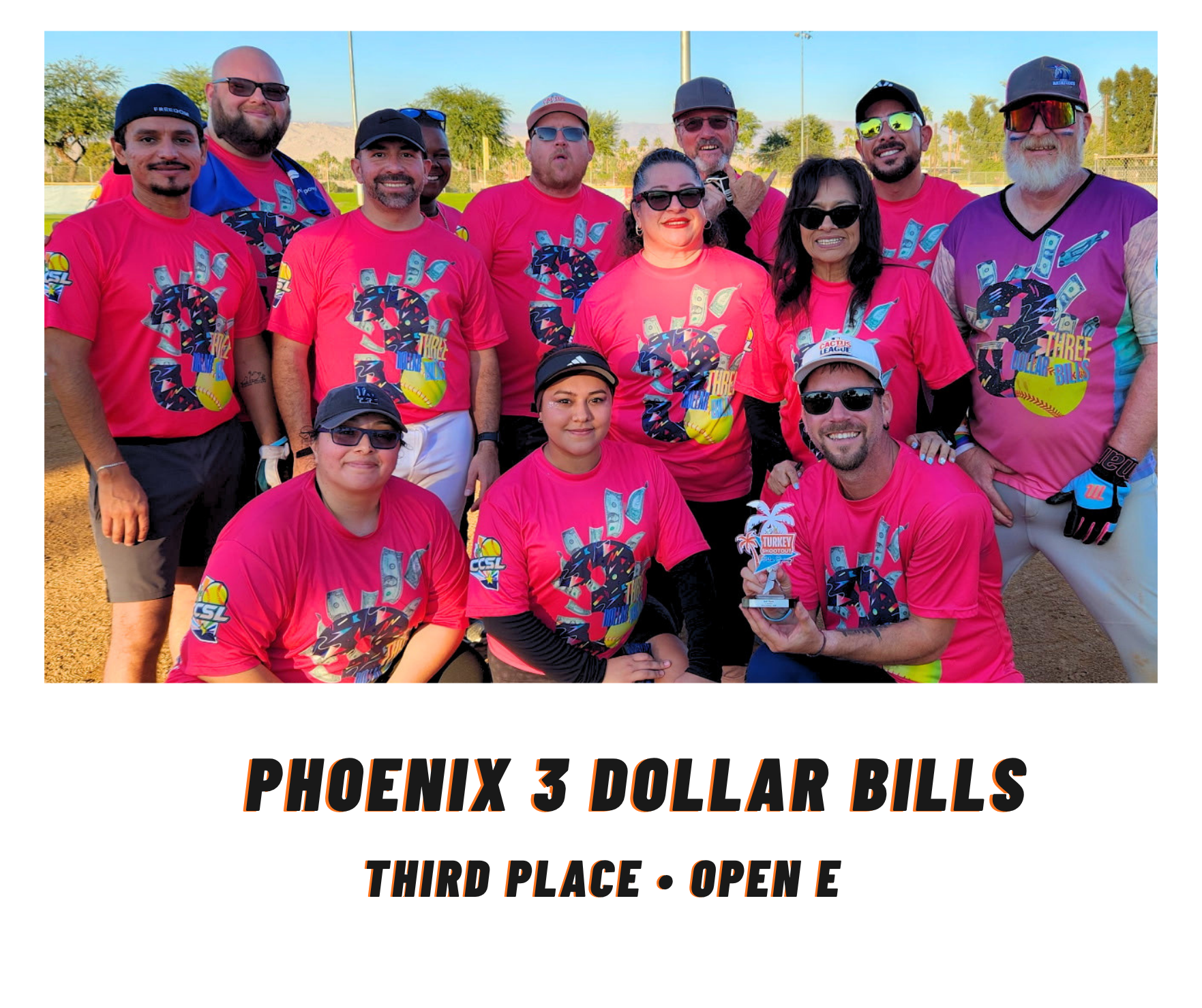 Team in bright pink shirts posing outdoors; text reads “Phoenix 3 Dollar Bills, Third Place - Open E”