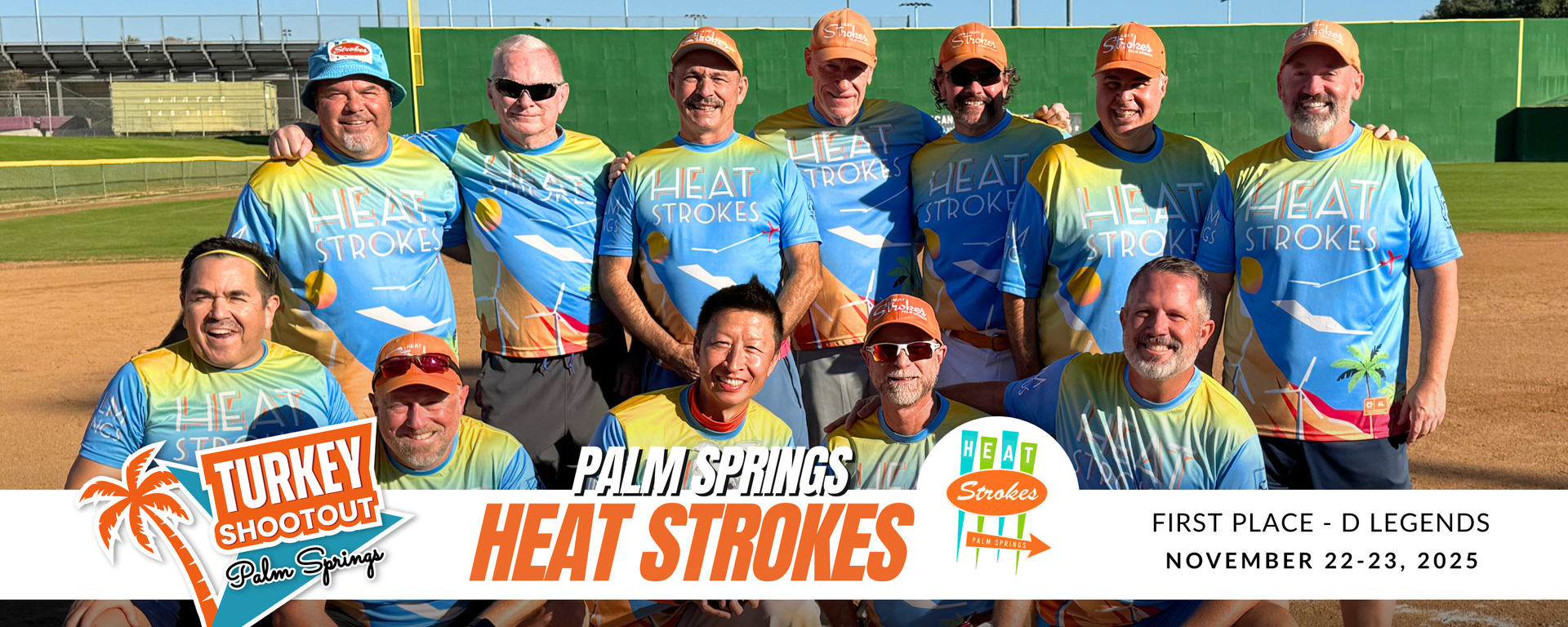 Group of runners in blue race shirts posing with event signs before a race on a track field