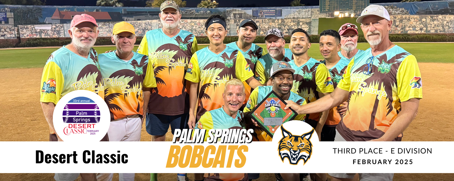 Youth baseball team in yellow jerseys posing with bats on a field, labeled “Desert Classic” and “Bugs.”