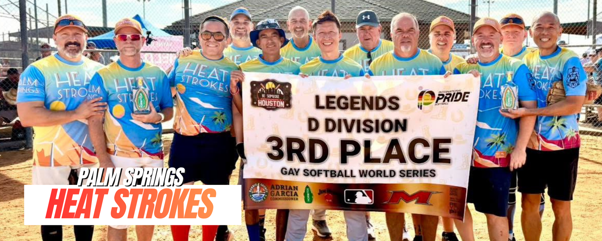 Cricket team in blue jerseys posing with banners after winning 3rd division grand final.