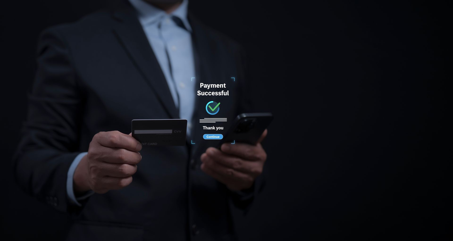 Man in suit holding a credit card and smartphone, purchase successful notification on the screen. Man in suit holding a credit card and smartphone, purchase successful notification on the screen.