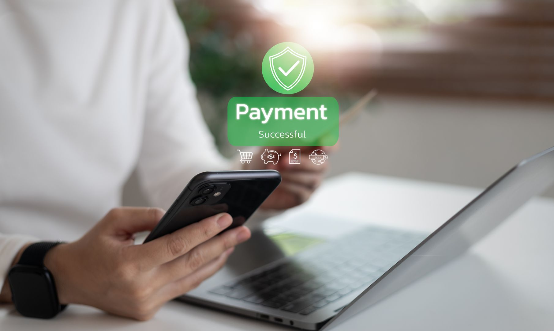 Person holding phone and credit card, making online payment via laptop. Person holding phone and credit card, making online payment via laptop.
