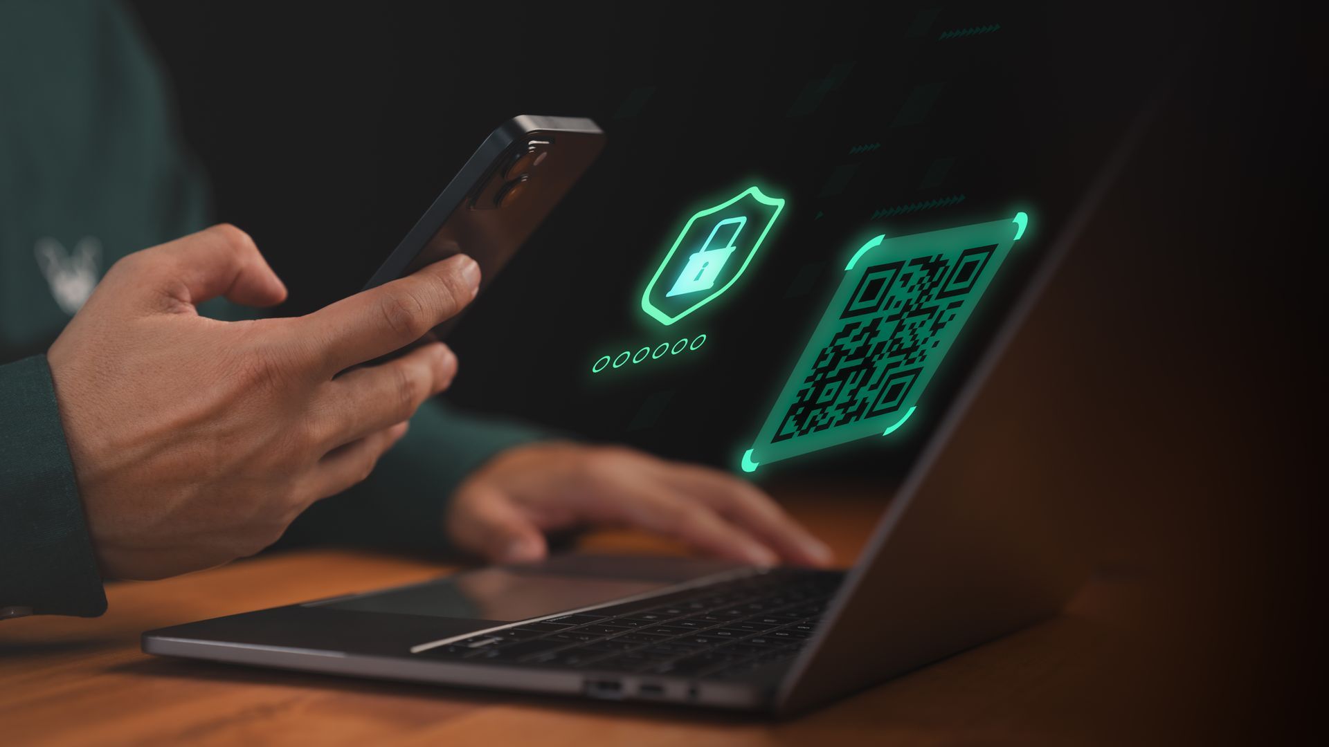 Person using phone to scan a glowing QR code on a laptop screen, with a digital shield icon. Person using phone to scan a glowing QR code on a laptop screen, with a digital shield icon.