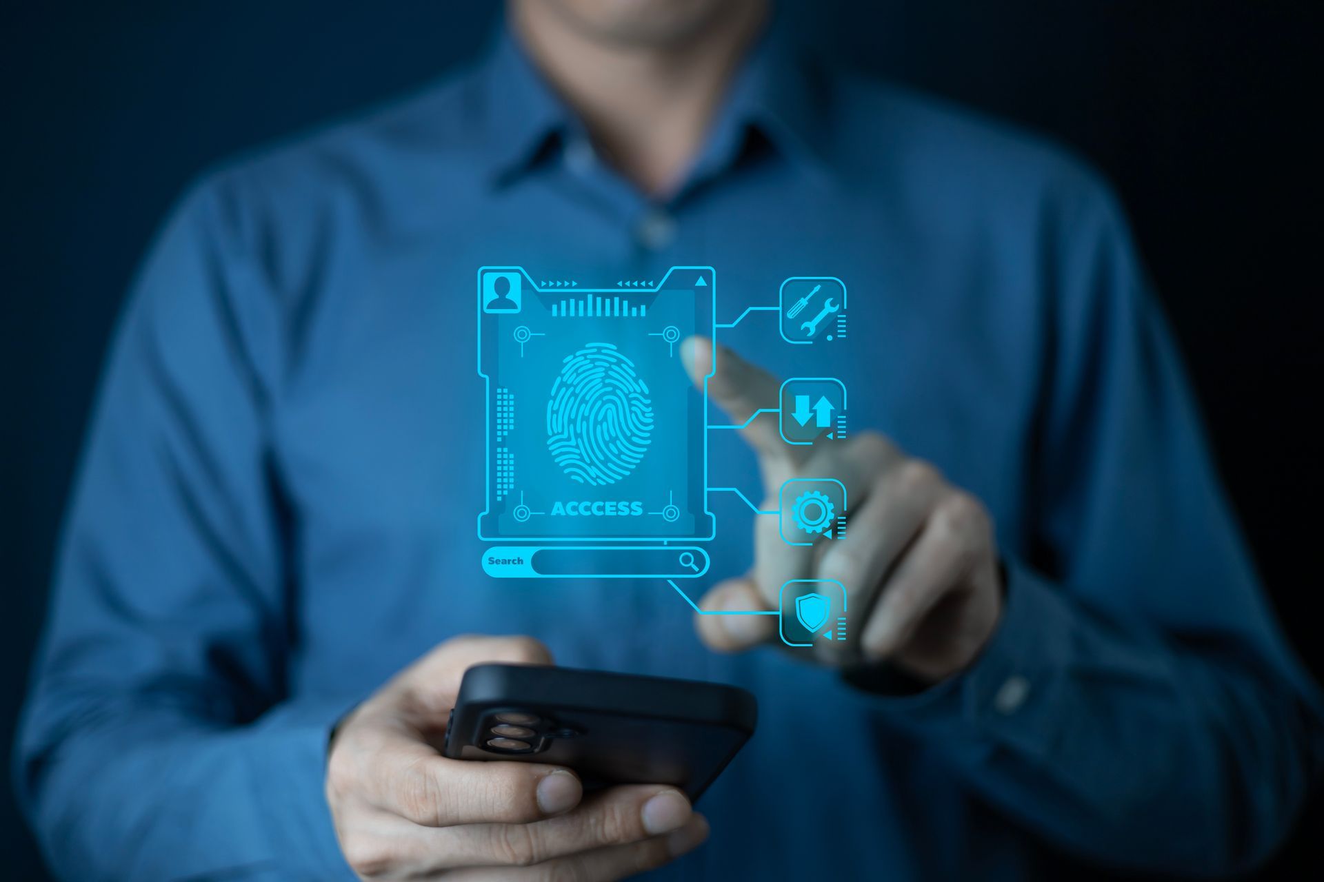 Man in blue shirt using smartphone with a digital fingerprint scan overlay. Man in blue shirt using smartphone with a digital fingerprint scan overlay.