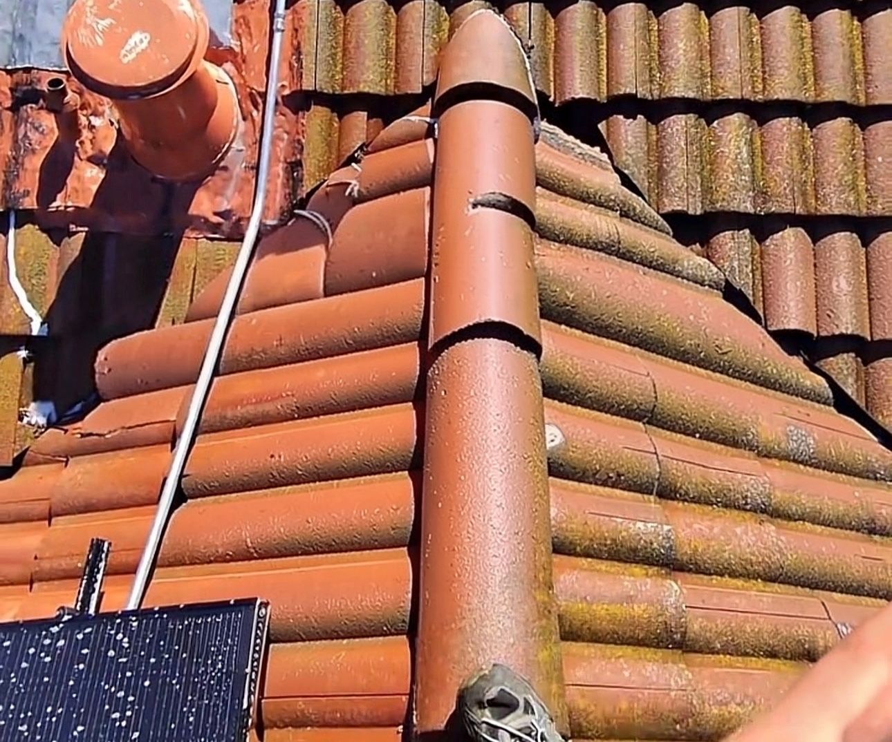Residential tile roof being professionally soft washed