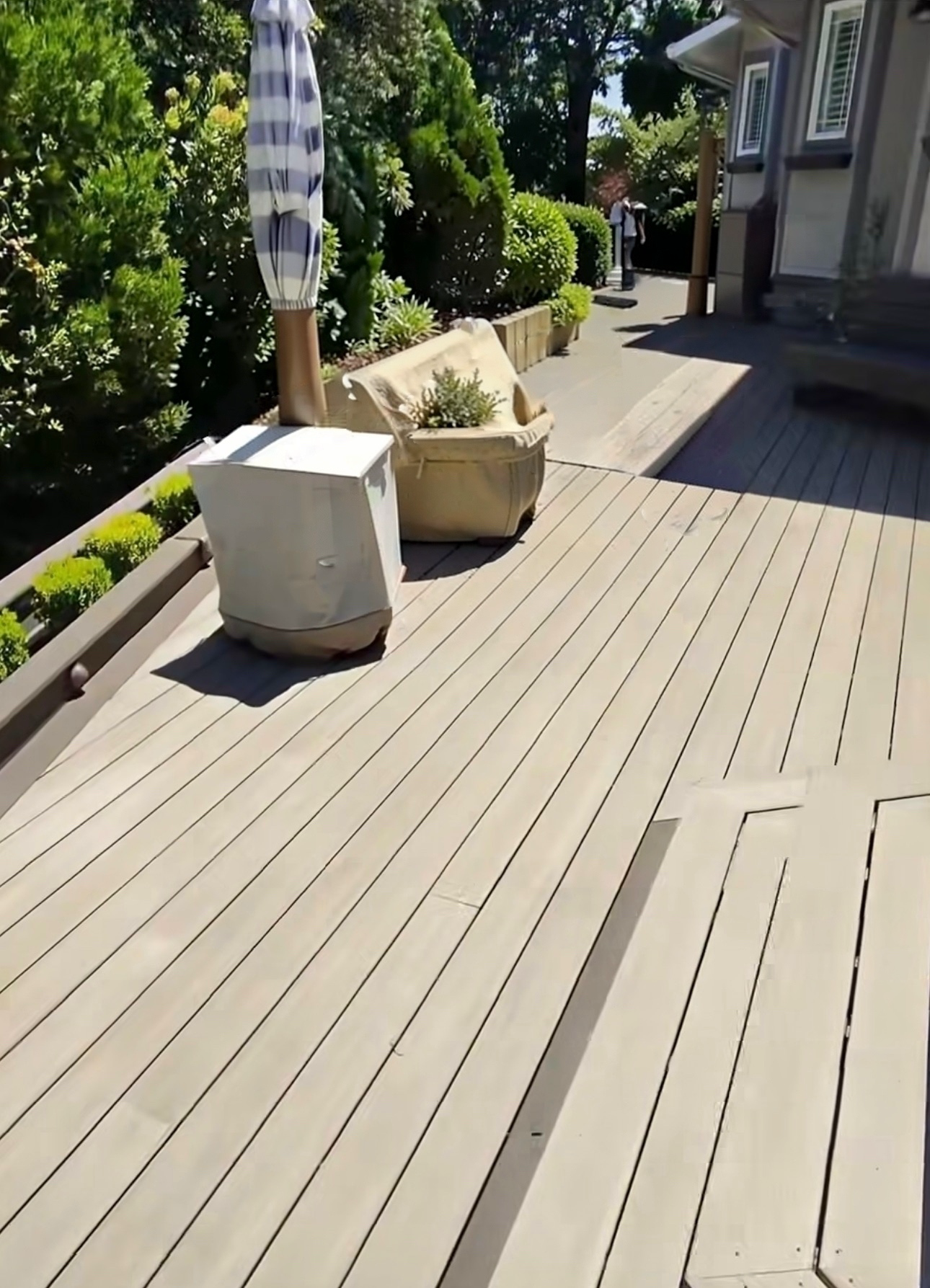Clean residential deck and patio after professional pressure washing