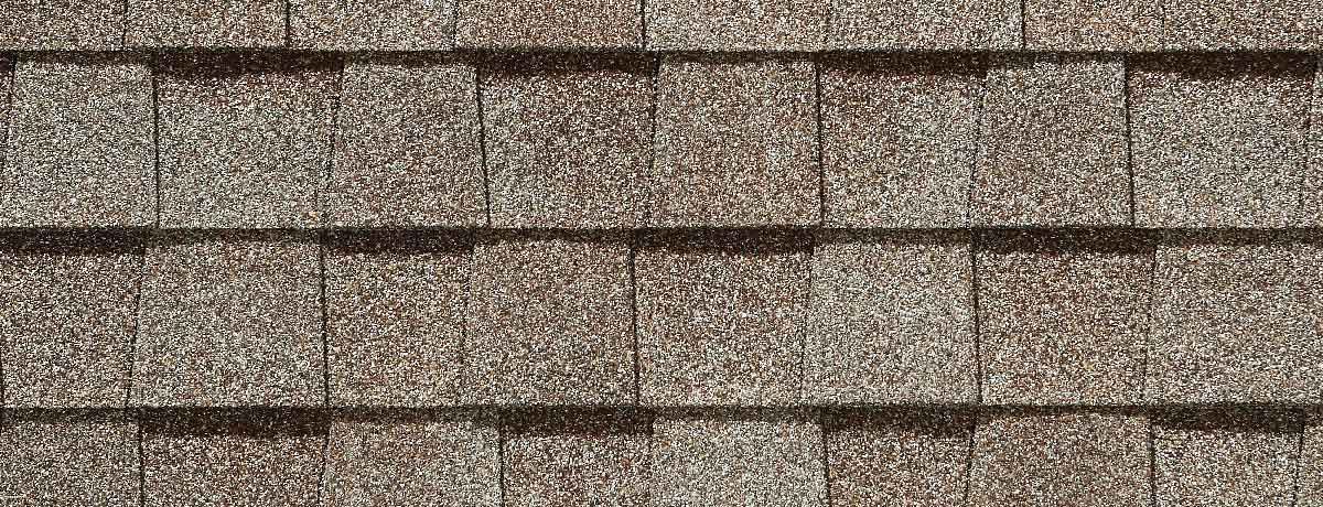 Close-up of brown asphalt roof shingles.