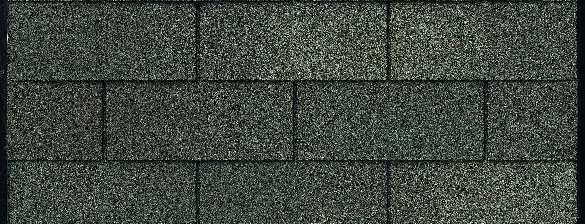 Close-up of dark gray architectural asphalt roof shingles.