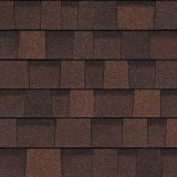 Brown asphalt roof shingles in a random pattern.