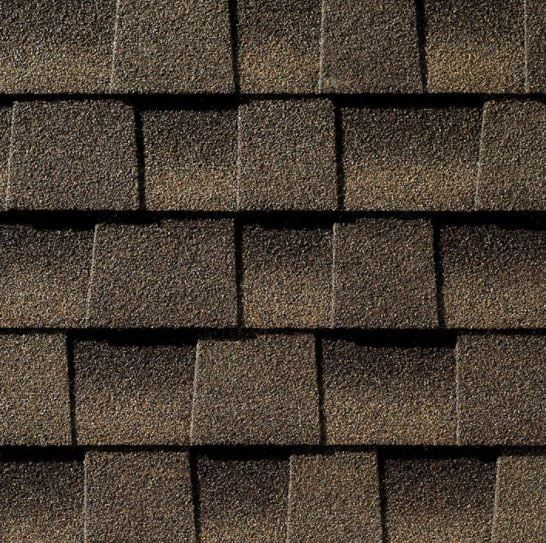 Close-up of brown asphalt roof shingles.