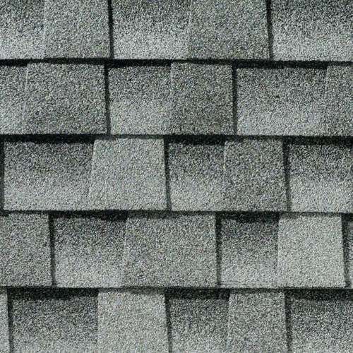 Gray asphalt roof shingles in an overlapping pattern.