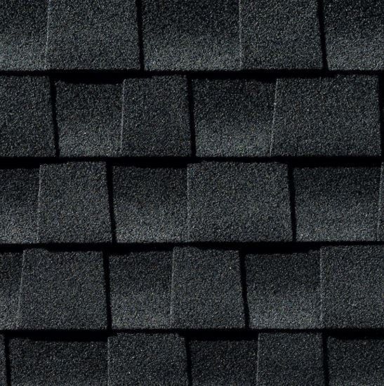 Black asphalt roof shingles, textured, in a grid pattern.
