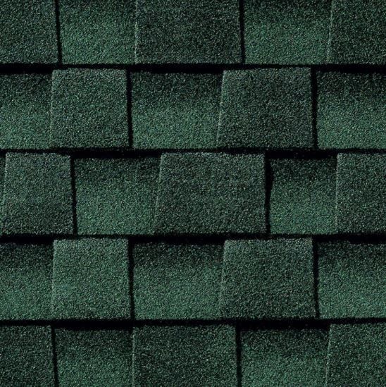 Dark green asphalt roof shingles, textured and overlapping.