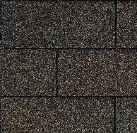 Brown asphalt roof shingles, arranged in a staggered pattern.