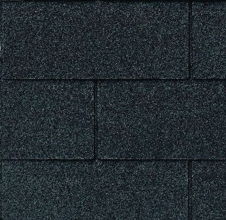 Close-up of dark blue asphalt roof shingles.